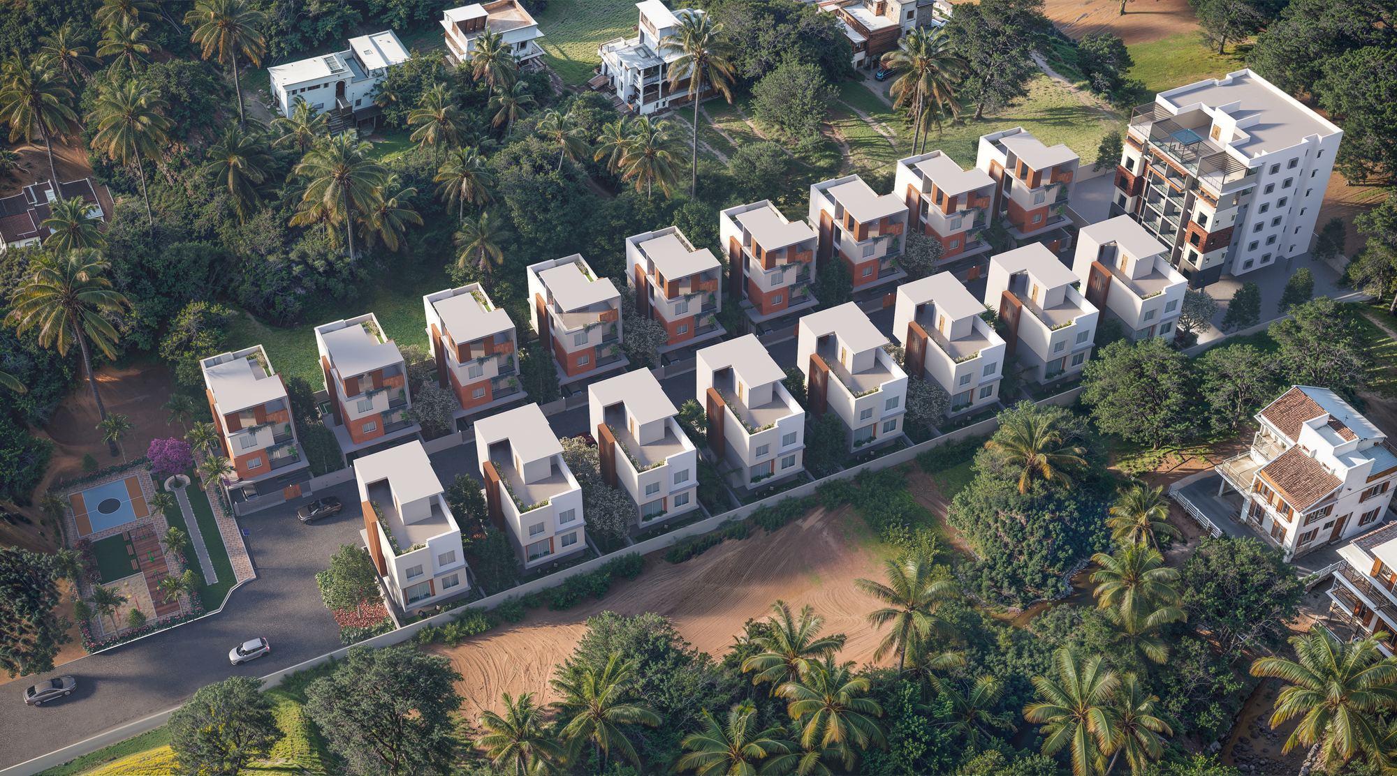 Aerial view of seventeen villas in two rows along a central drive, surrounded by a belt of coconut palms.